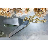 2 Piece Gold-leaf (twig) Cake Server Set. 1 Cake Knife and 1 Cake Server. Leaf Design 2 Tone Made of Stainless Steel and Brass. Ideal for Weddings, Party's, Elegant Events.